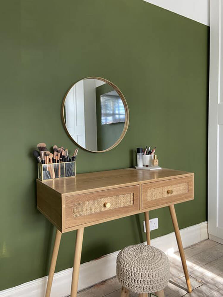 Light oak dressing table in a bedroom painted in Lick Green 05