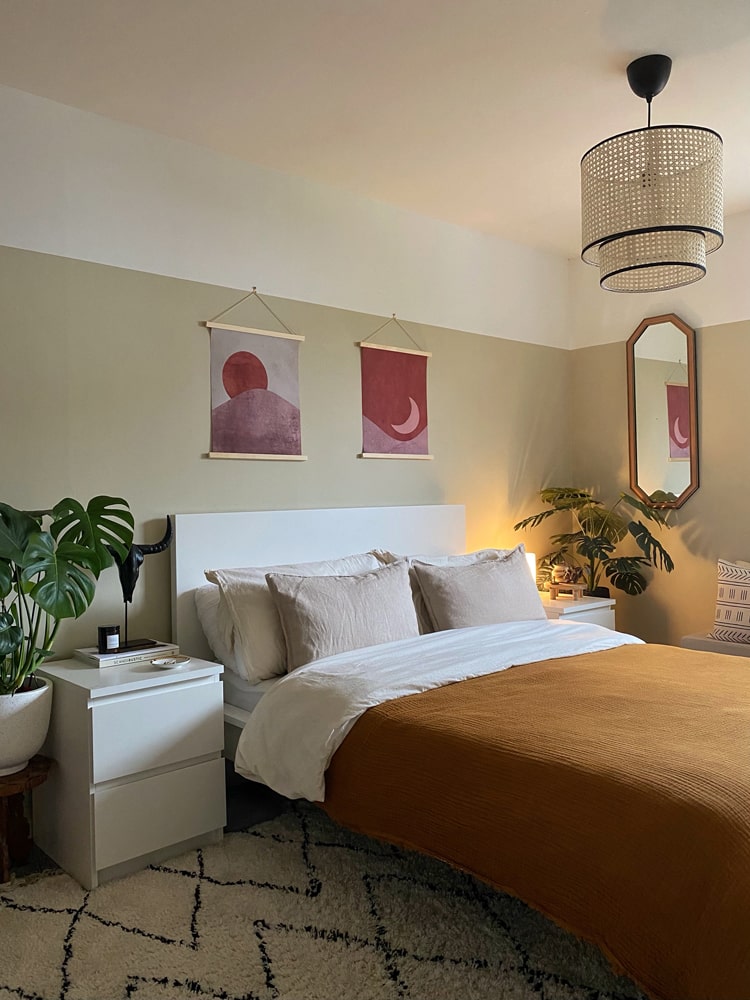Boho Chic bedroom with orange bedding and wooden furnishings 