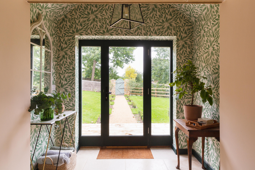 Entrance hall decorated in Lick Botanical wallpaper