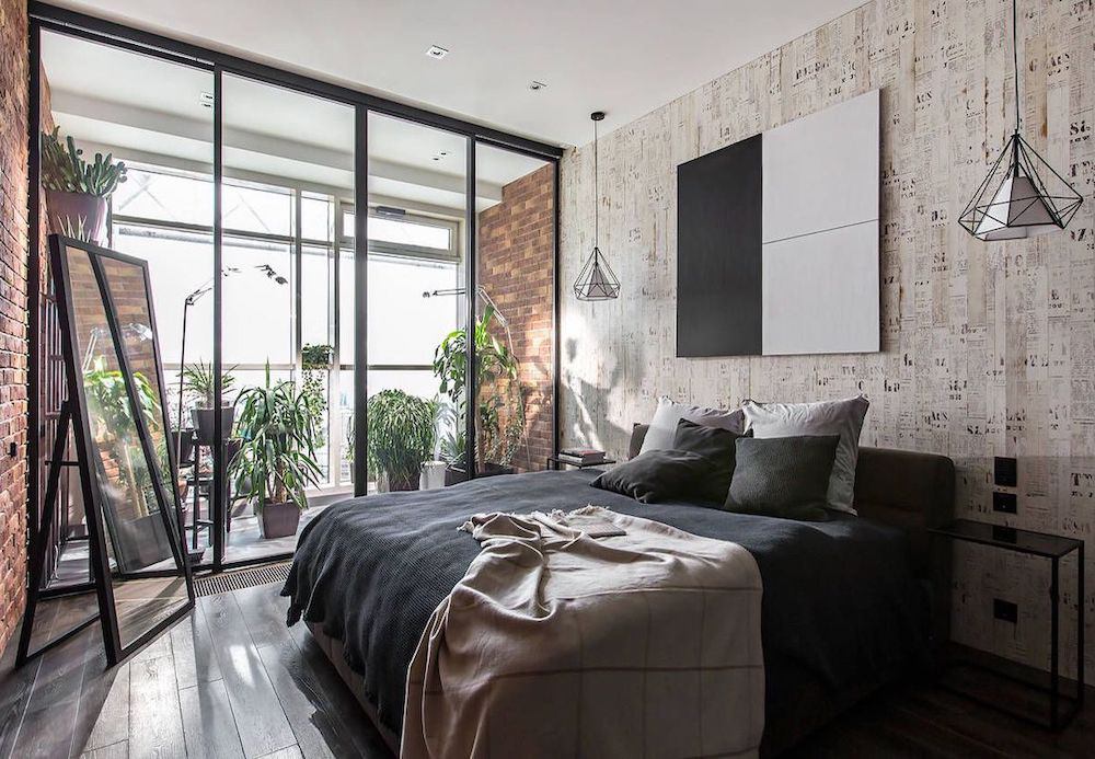 Monochrome bedroom with metal accents and large windows