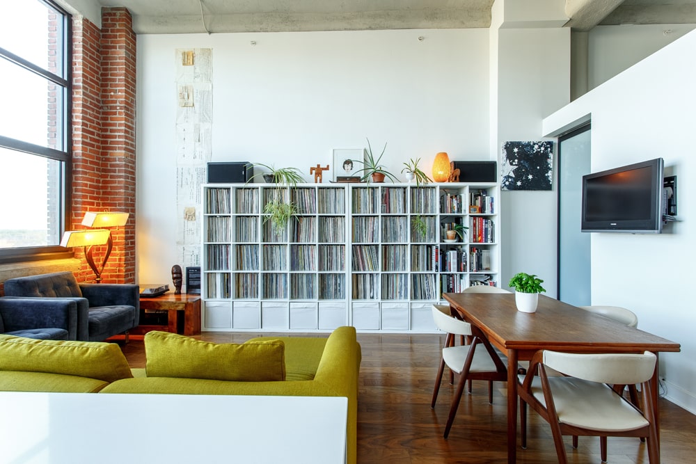 Industrial living room with large bookcase 