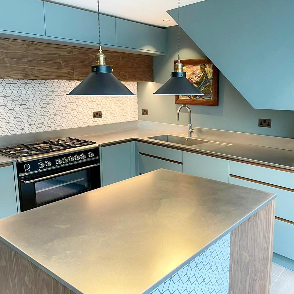 Industrial kitchen with steel countertops and walls decorated in Lick Teal 02 paint shade by @WESTANDREID