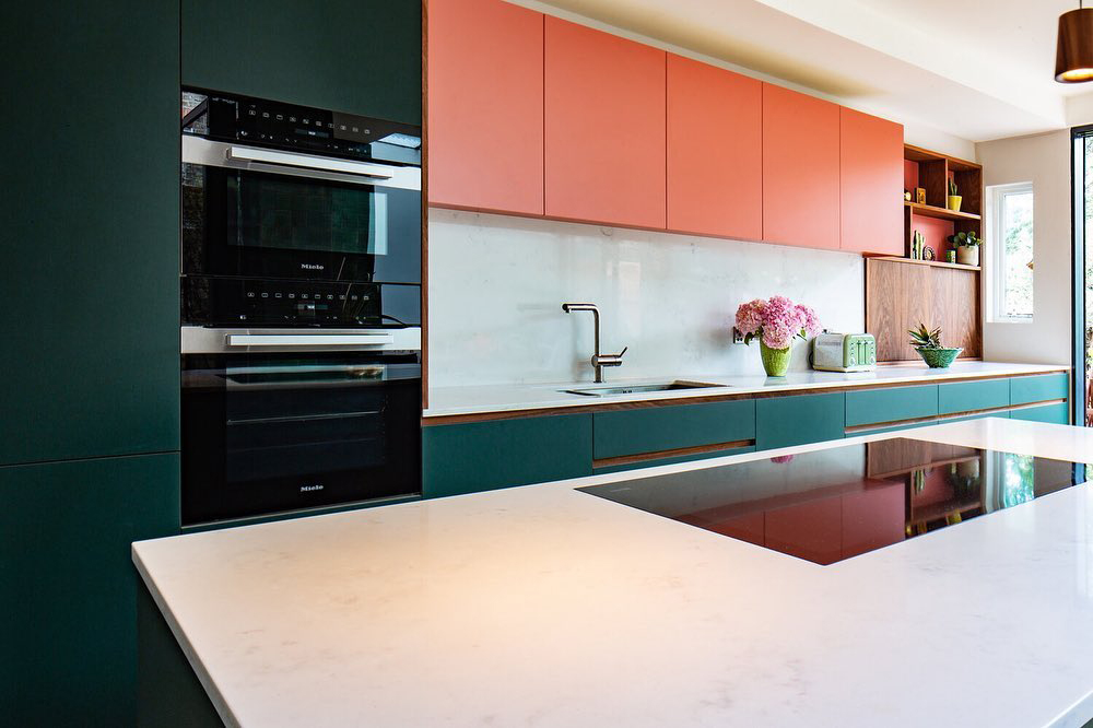 Red and green kitchen with gold accents and oversized counter