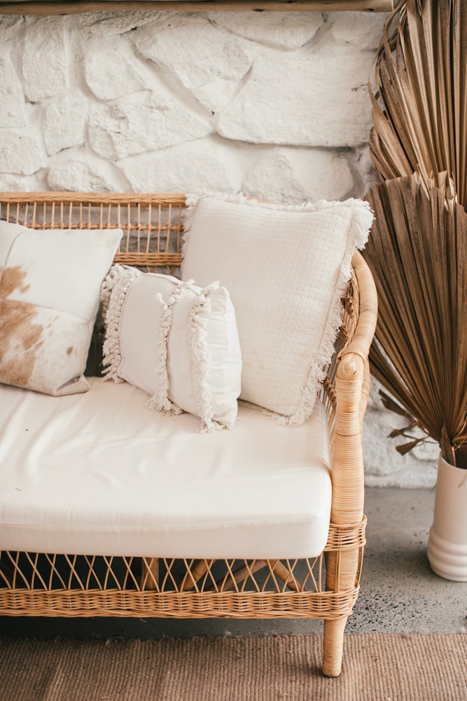 Tassled pillows on a wooden chair