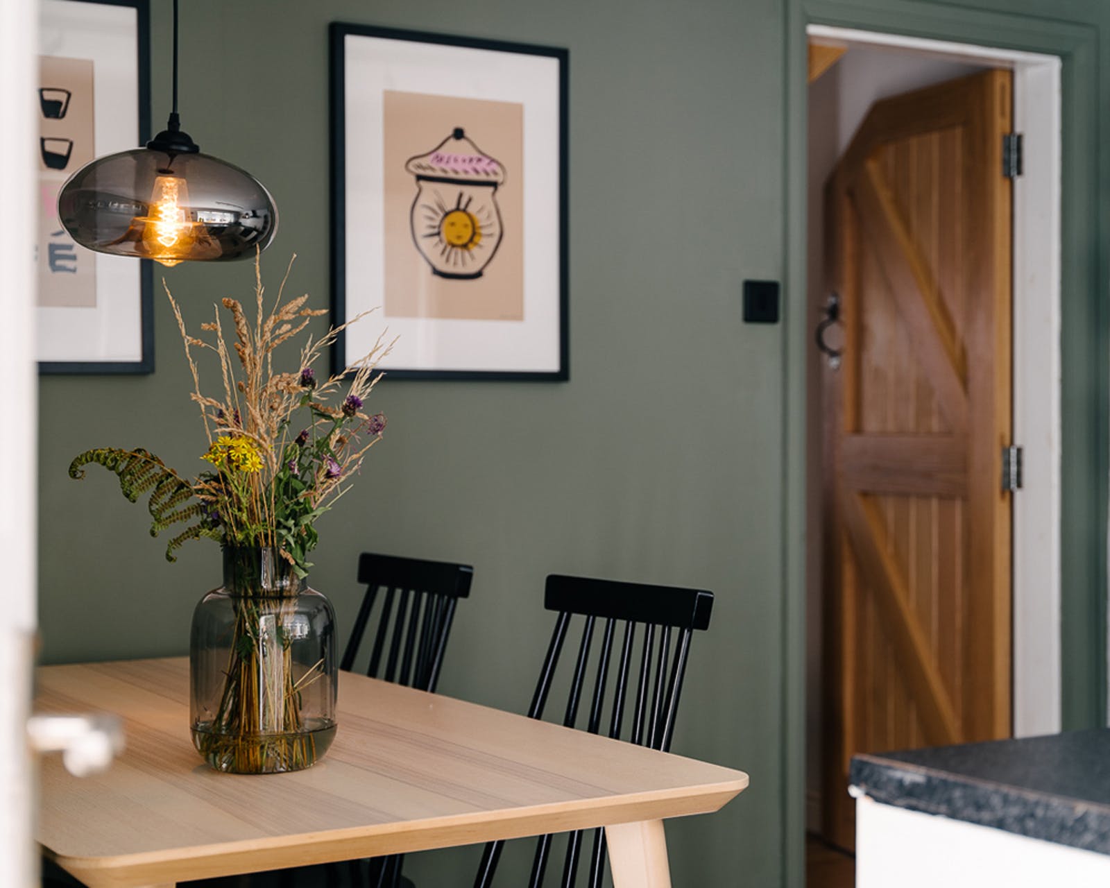 Cottage core interior trend dining room with natural wood features and walls painted in Lick paint Green 02