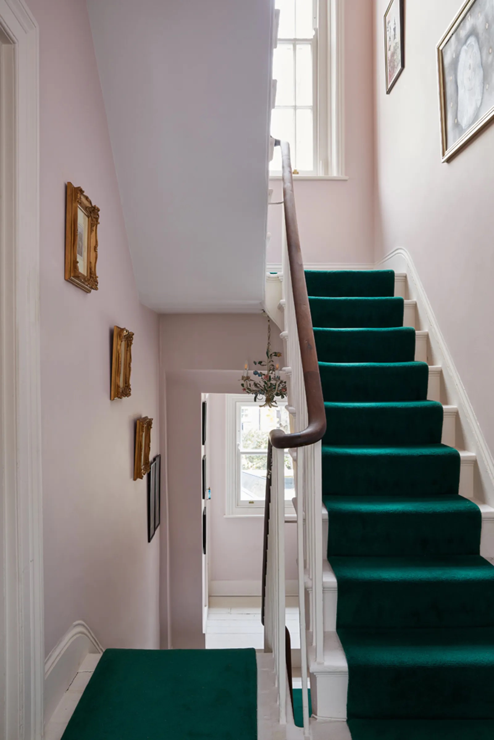 Daisy Lowe's hallway walls painted in Lick Pink 04 and staircase decorated in Lick Pink 01 paint shade