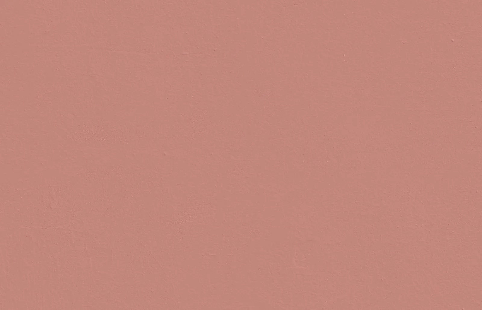 Textured wall decorated in Lick Red 03 paint shade