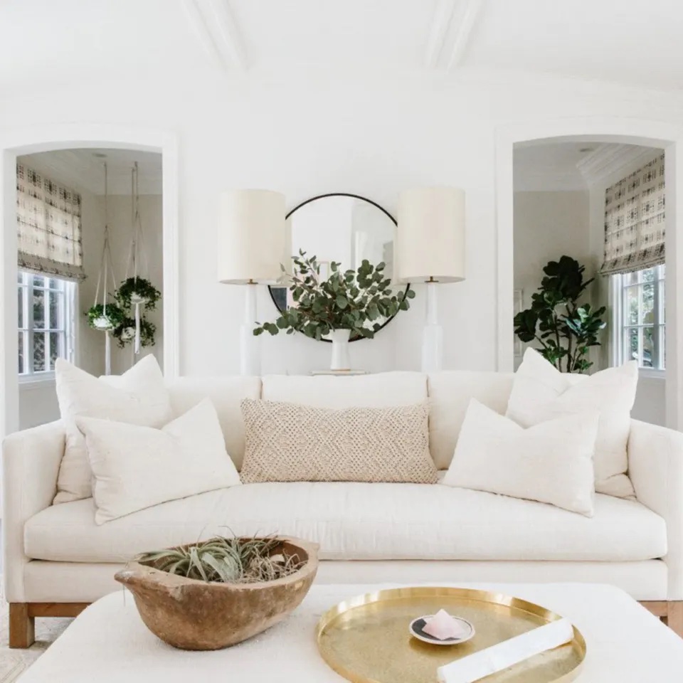 Modern farmhouse living room with white linen sofas by Erin Fetherston