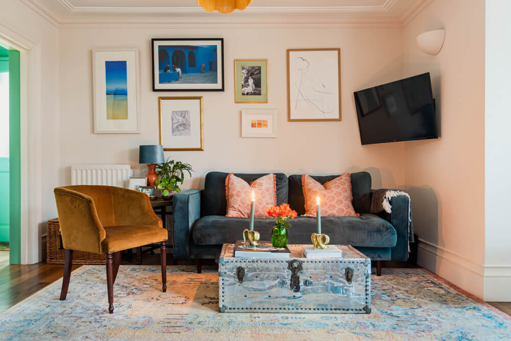 Living room with a gallery wall decorated in Lick Pink 01 paint shade