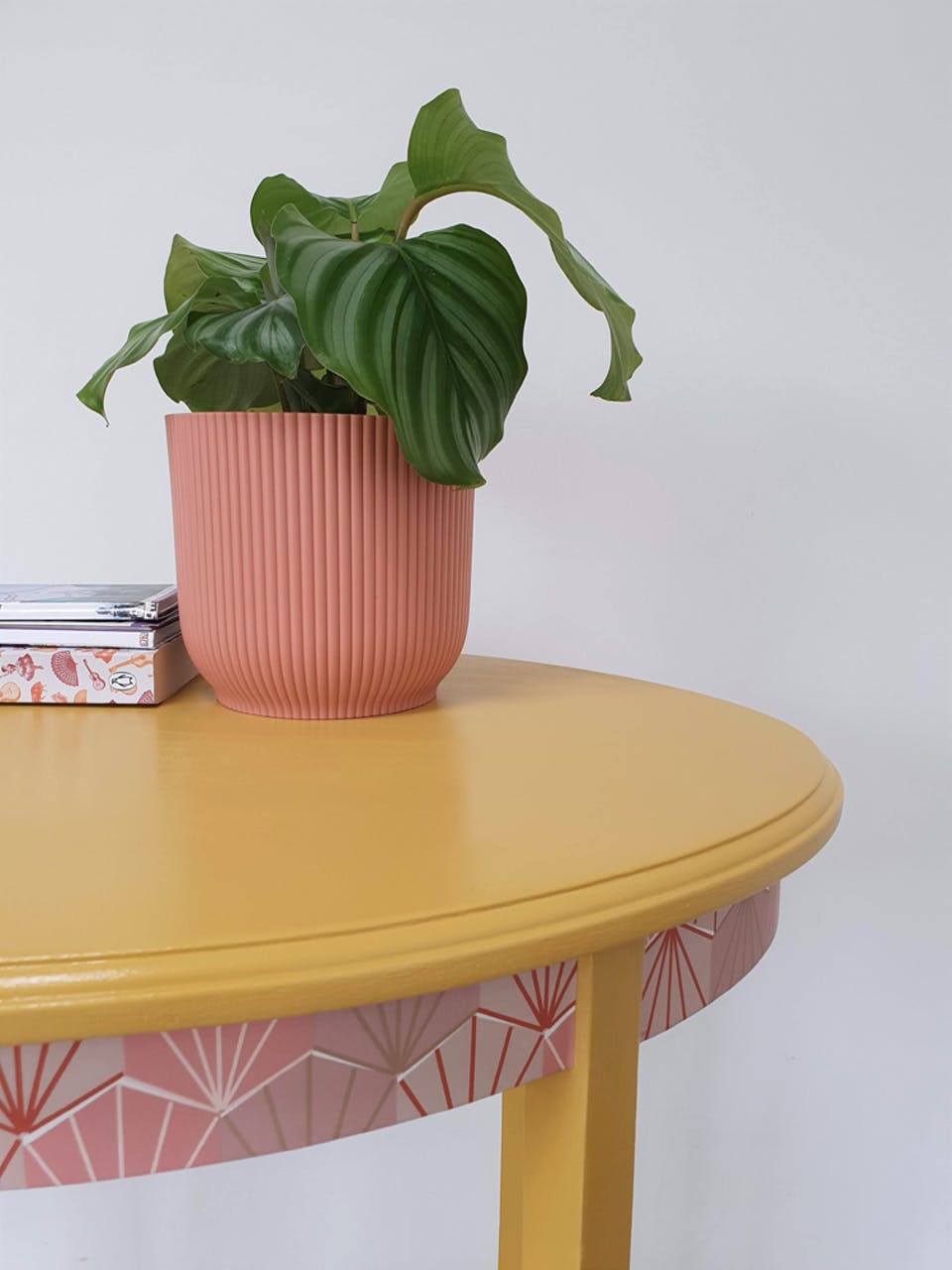 Side table upcycled by painting in Lick paint Yellow 02 and using wallpaper remnants