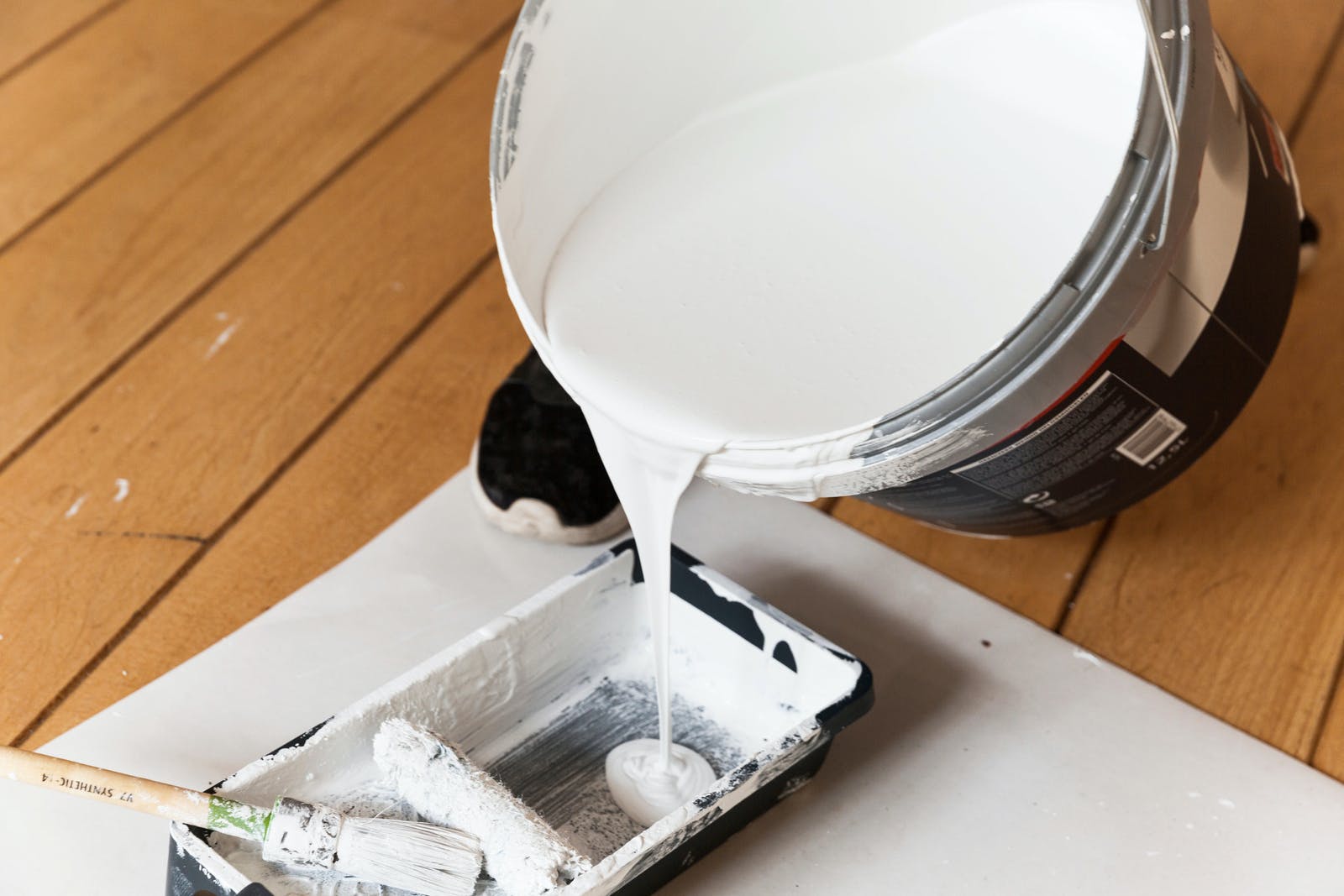 White primer paint being poured