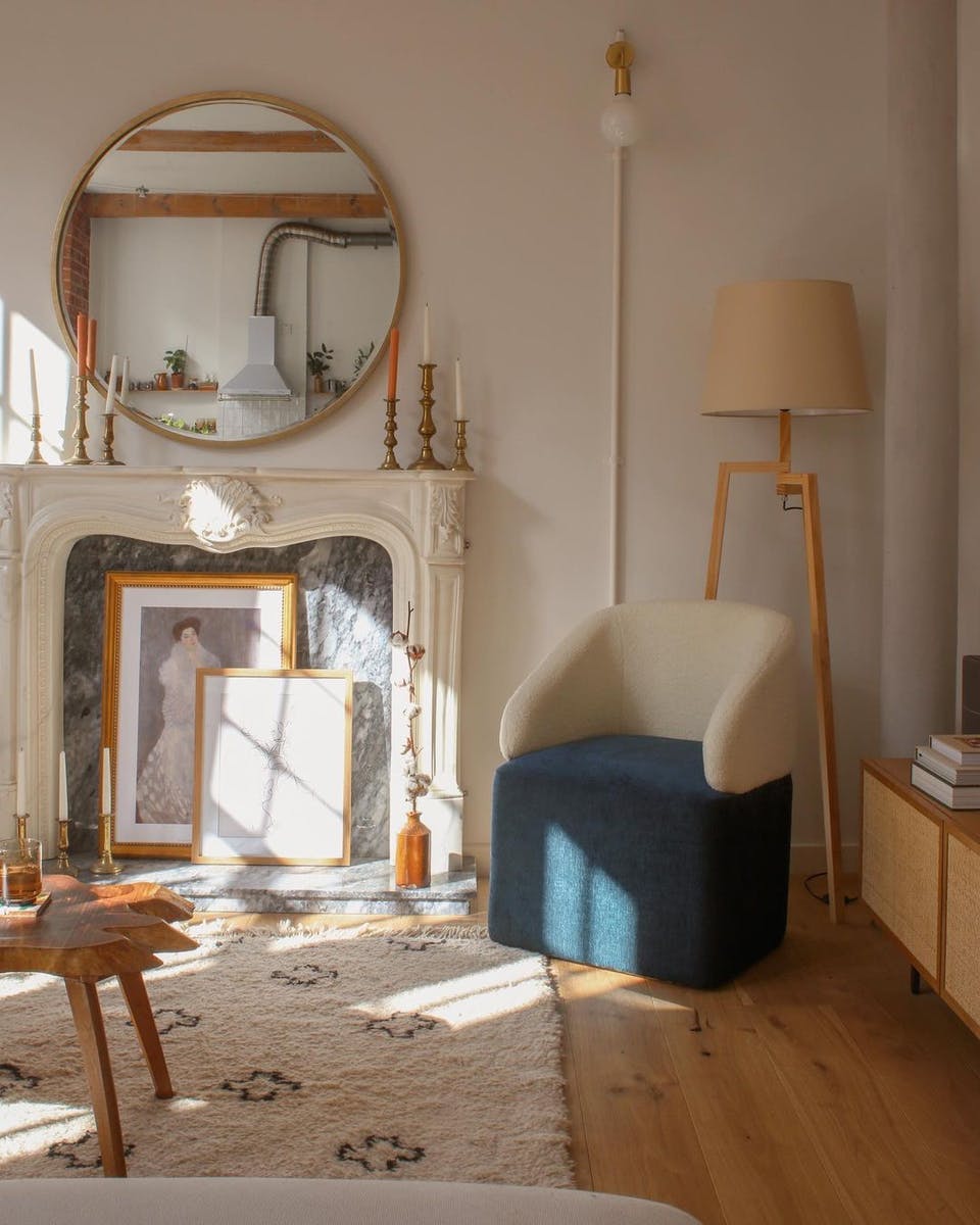 Neutral colour palette living room with ornate fireplace