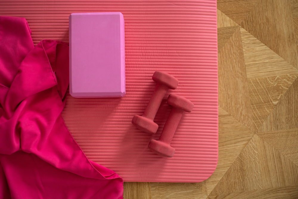 Pink yoga mat and weights