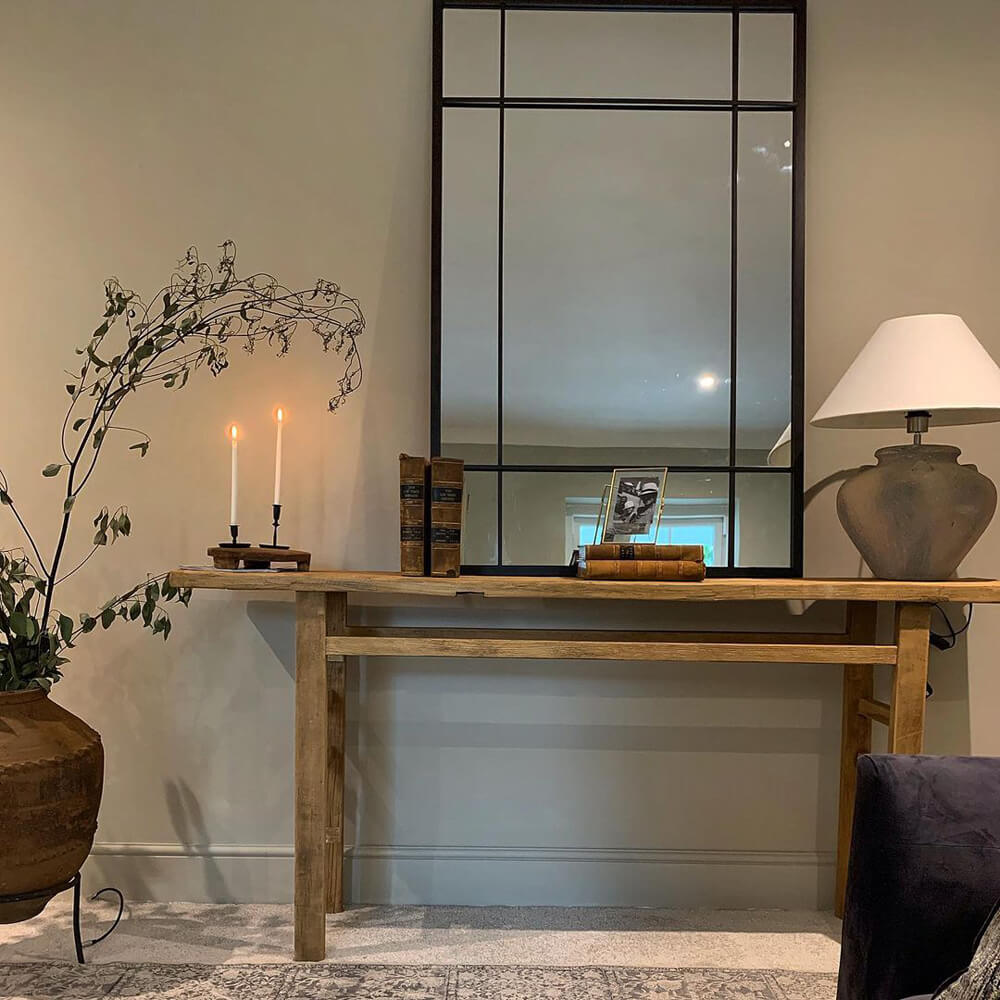 Windowpane mirror in a modern farmhouse living room painted with Lick Beige 03 by @inside_number_5_