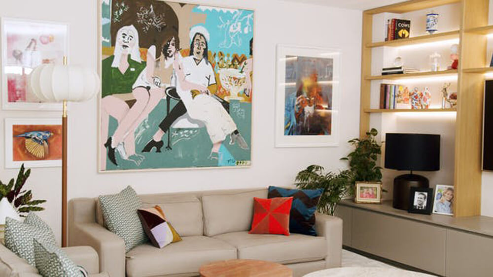 Vogue Williams' living room painted in Lick Pink 01 with a gallery wall
