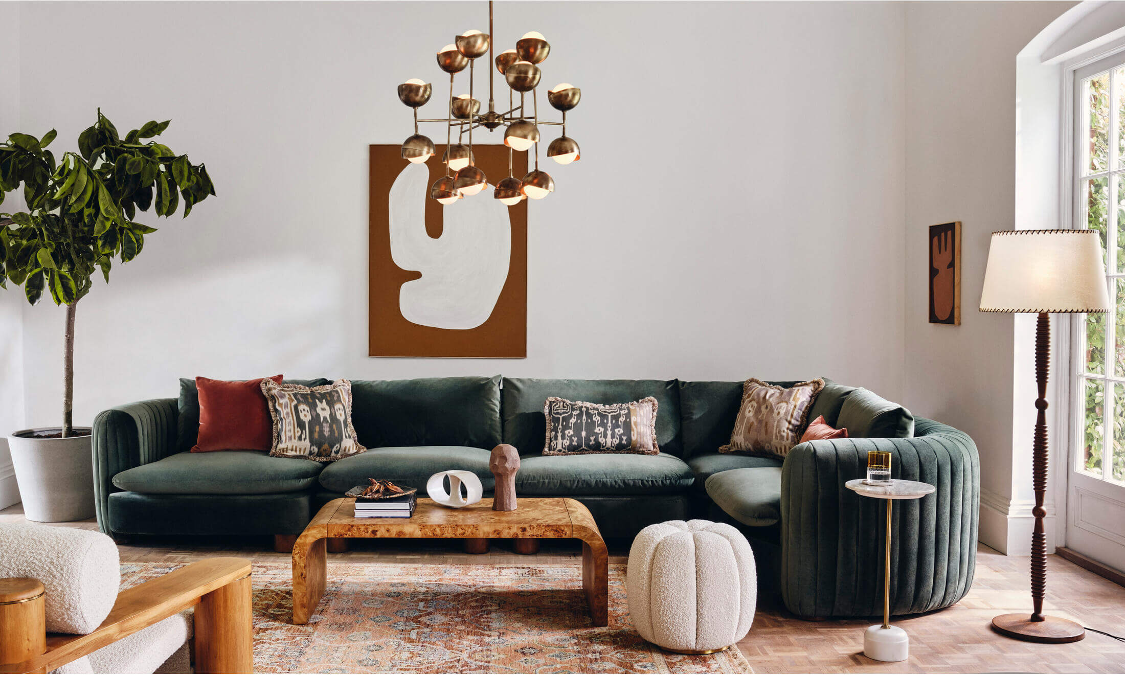 Contemporary living room with green sofa and brown furnishings