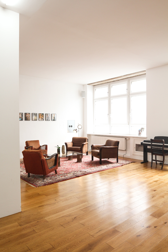 Industrial decor in living room with wooden floors
