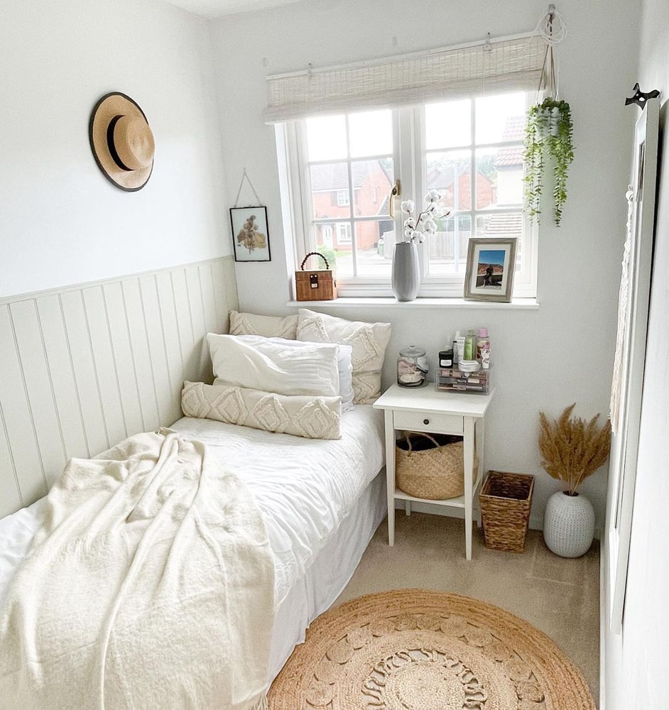 Small boho chic inspired bedroom with wooden accents 
