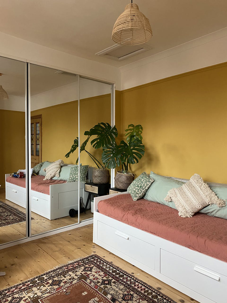 A boho living room painted in Lick Yellow 02 paint