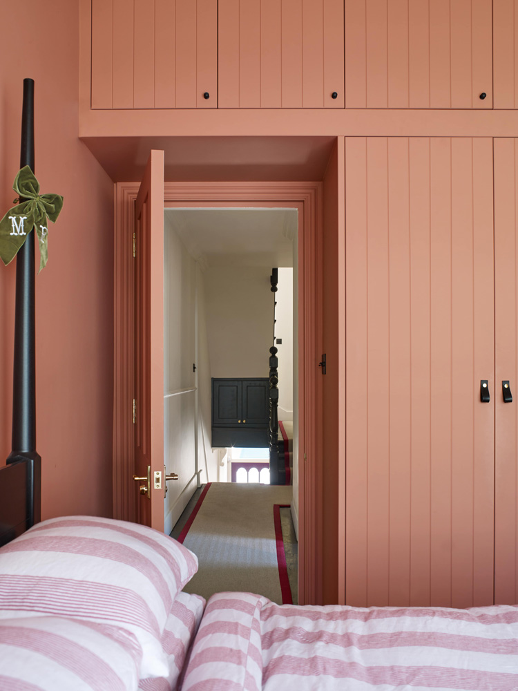 Mary Charteris's guest bedroom painted in Lick Red 03 paint
