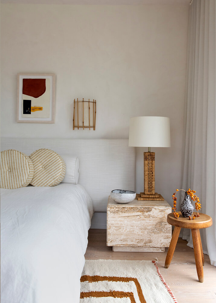 Light contemporary bedroom with wood and rattan accents