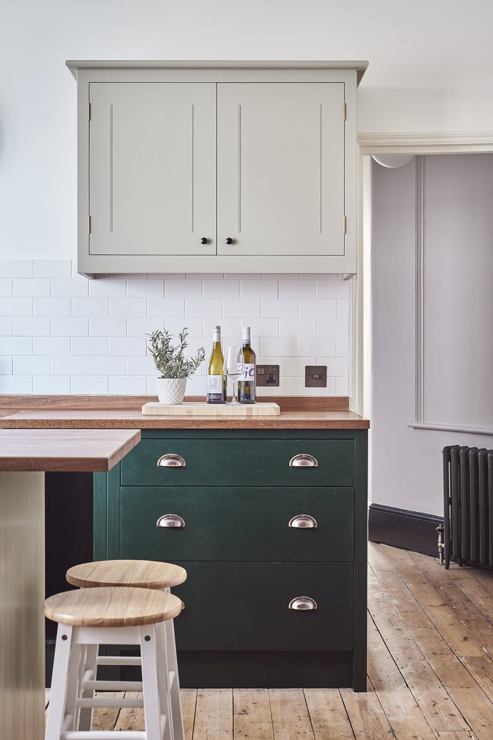 Kitchen cabinets painted in Lick Greige 02 and Green 06