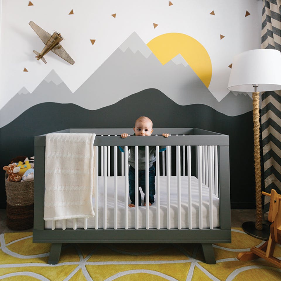 Kids bedroom DIY monochrome grey mountains behind cot