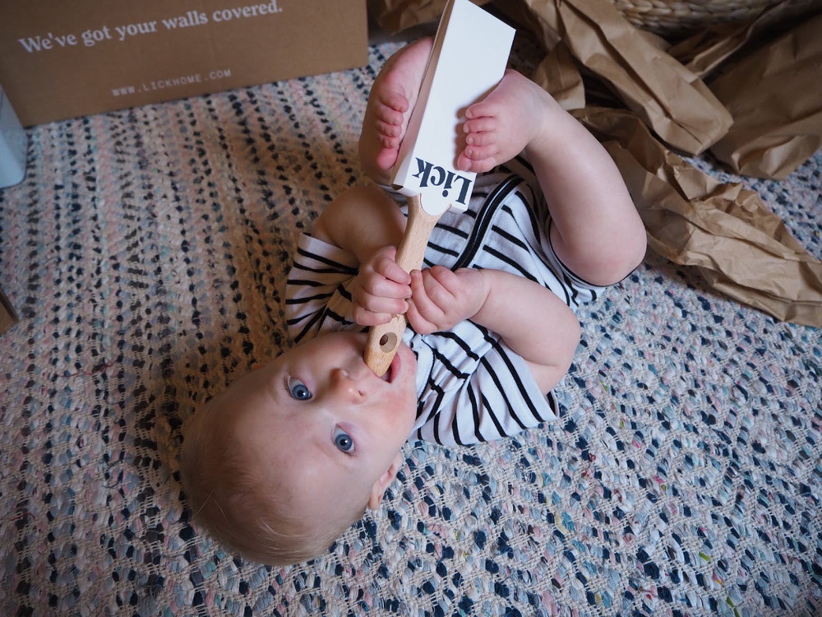 Baby with eco-supply paintbrush courtesy of @_farley_and_me_