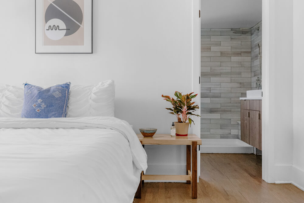 Blue and White modern bedroom with wood finishes 