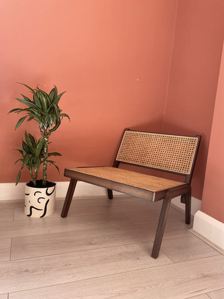 Rattan chair in room painted in Lick Red 03