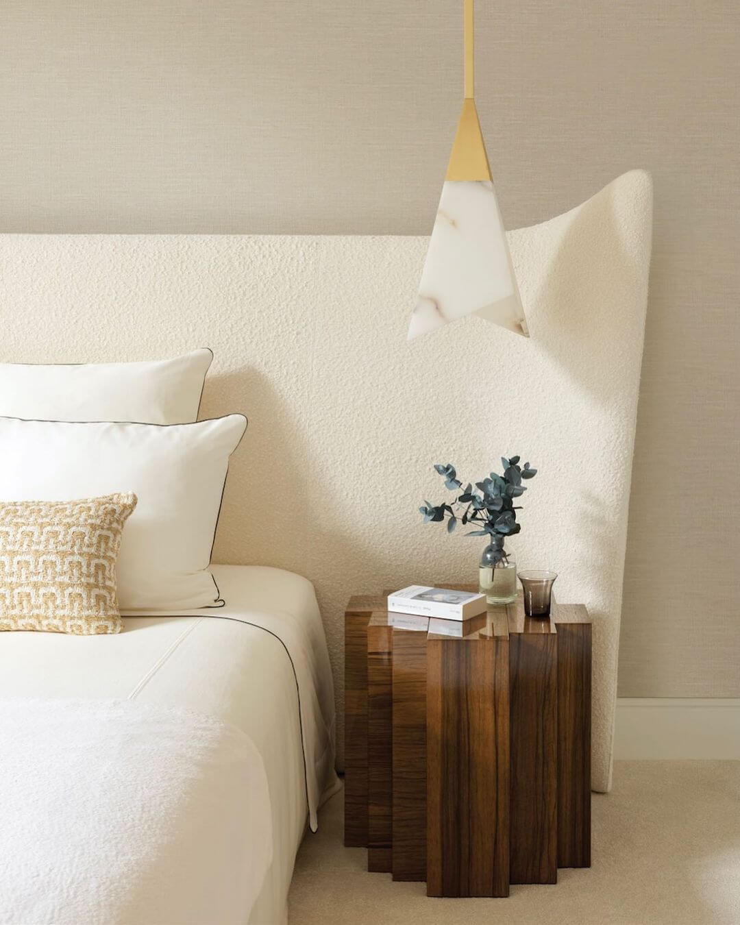 Beige bedroom with marble light fixture
