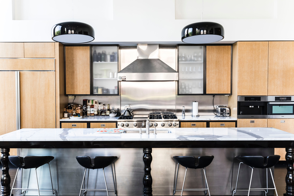 Stainless steel kitchen with wooden cabinets 