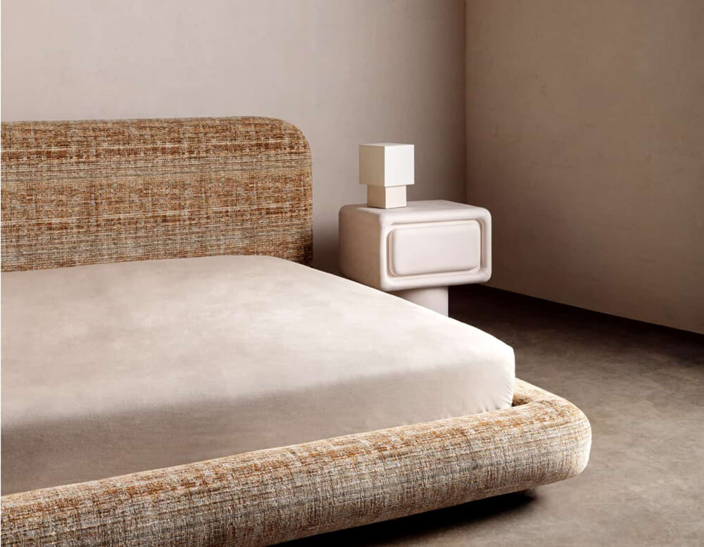 Brown velvet bed frame with stone furnishings