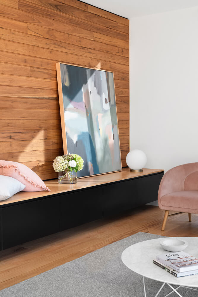 Wood panelled wall with abstract artwork