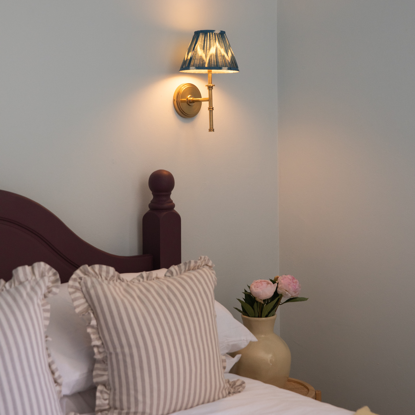 Colour-drenched bedroom in Blue 02 with Purple 03 upcycled headboard