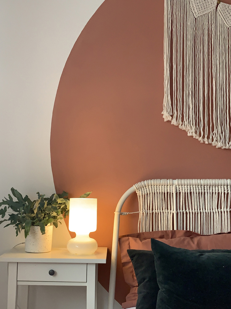 Macrame headboard in bedroom painted in Lick Red 03