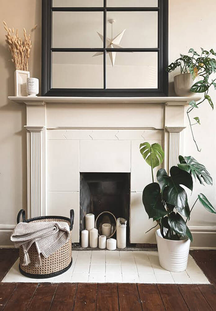 Image of Beige 01 fireplace, accessorised with house plants and candles
