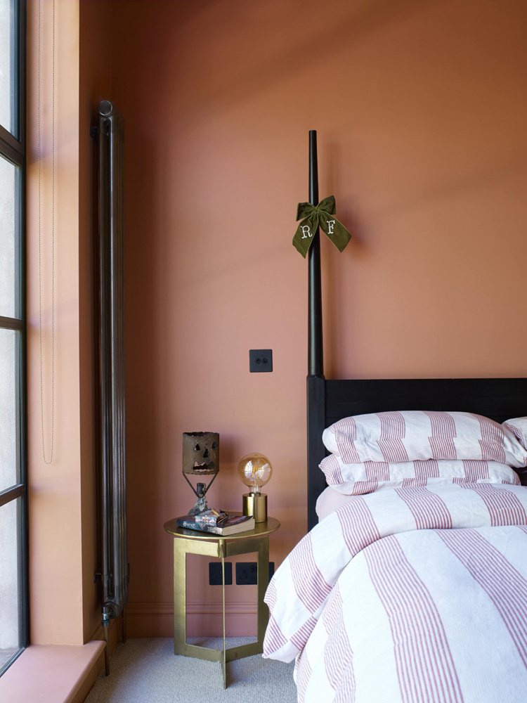 Mary Charteris's guest bedroom painted in Lick Red 03 paint