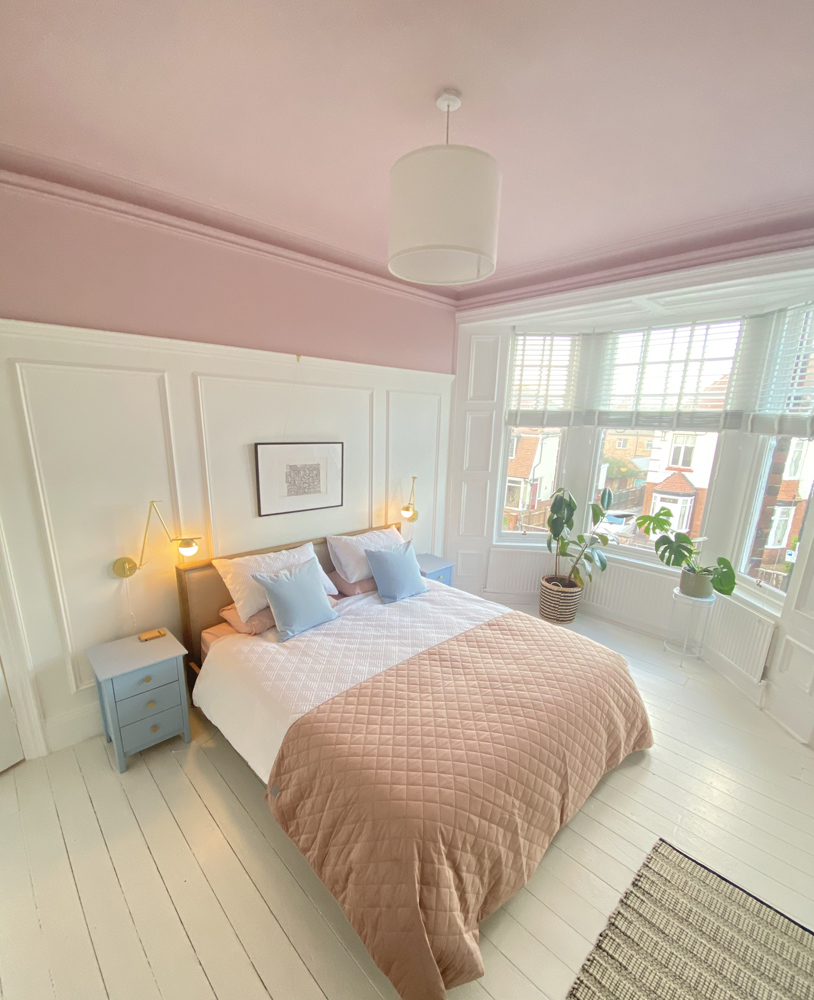 Bedroom ceiling painted with Lick paint Pink 03 with panelling on walls