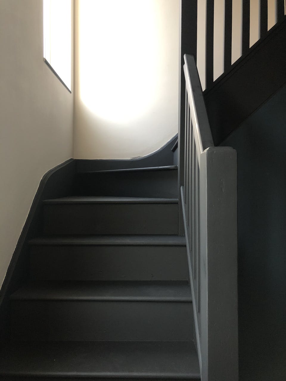 Black staircase painted in Lick Black 02