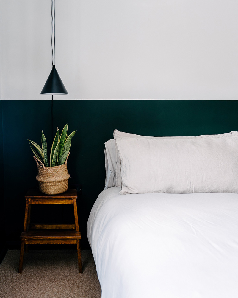 Bedroom half painted in Lick Green 06 paint