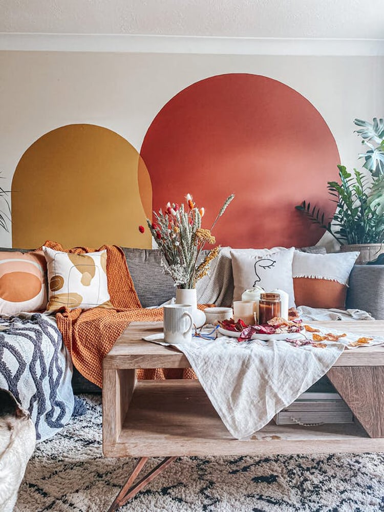 Colour blocking with paint on the walls of a living room, using Lick Red 03 and Yellow 02 paint