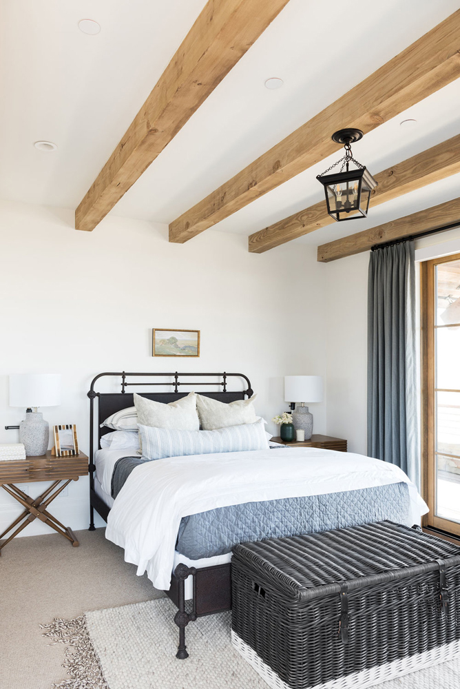Modern farmhouse bedroom with a wrought iron bed by Studio McGee