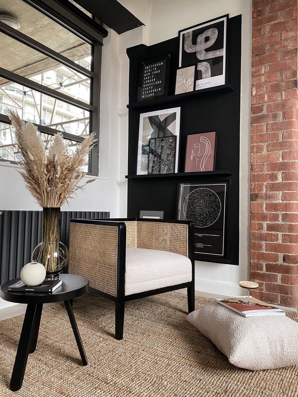 Gallery wall painted in black with scandi interior