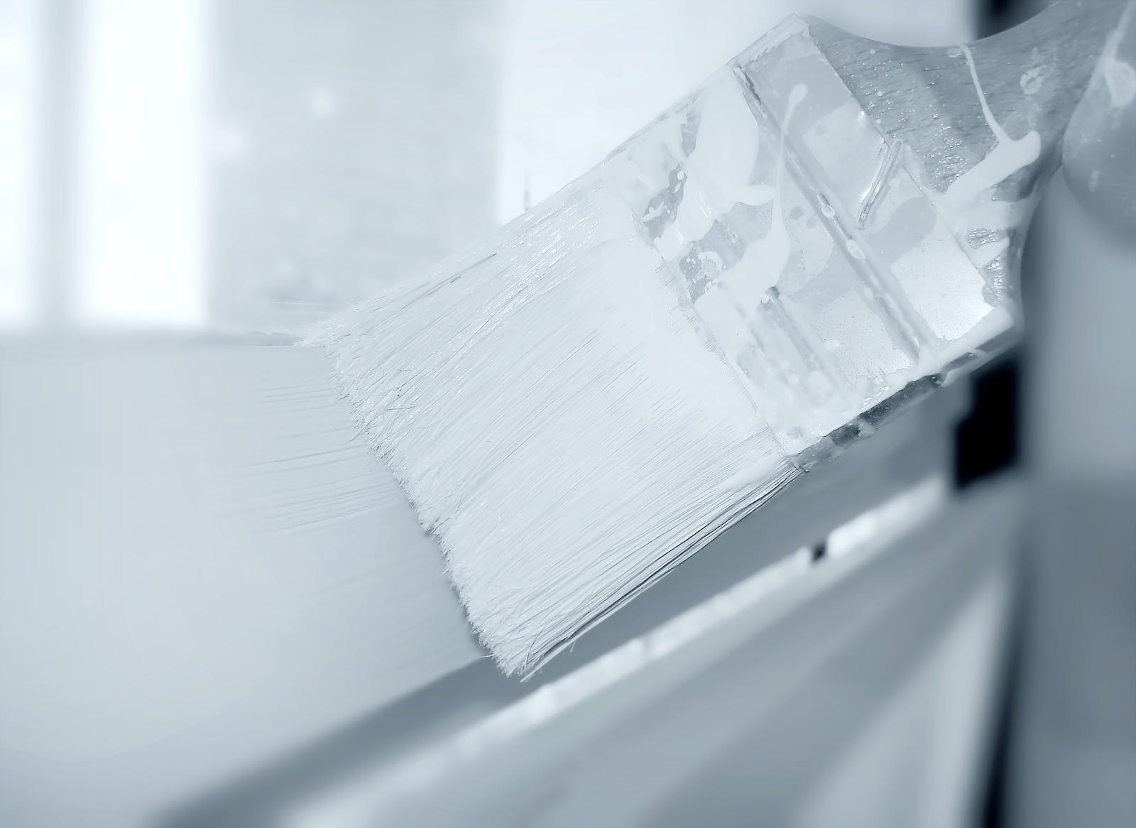White primer on paint brush