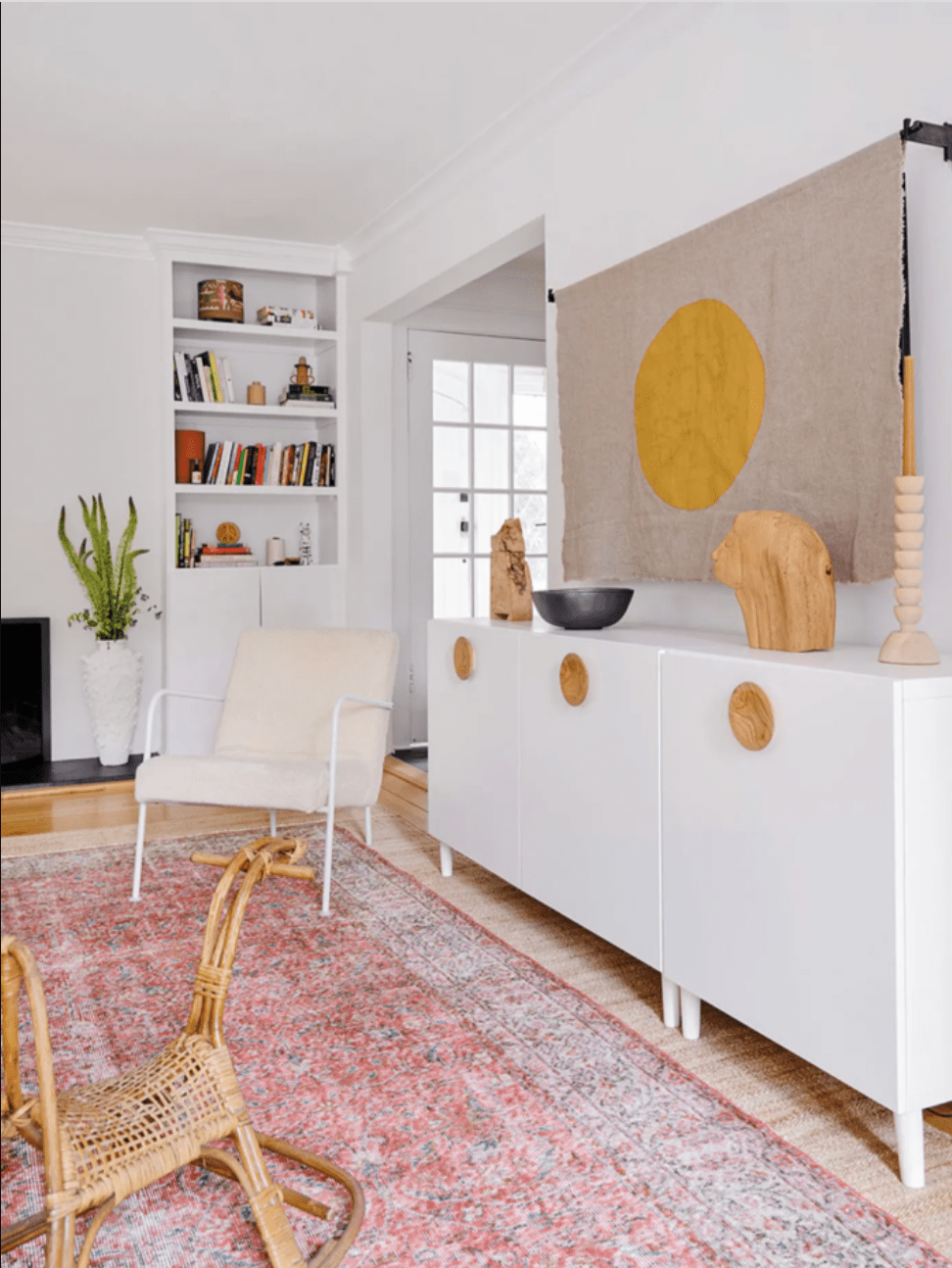 TV hidden by tapestry in living room