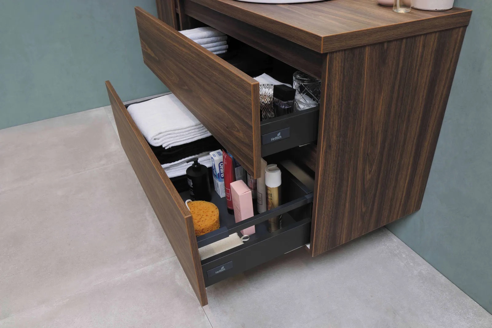 Wooden bathroom cabinet with open drawers via Unsplash