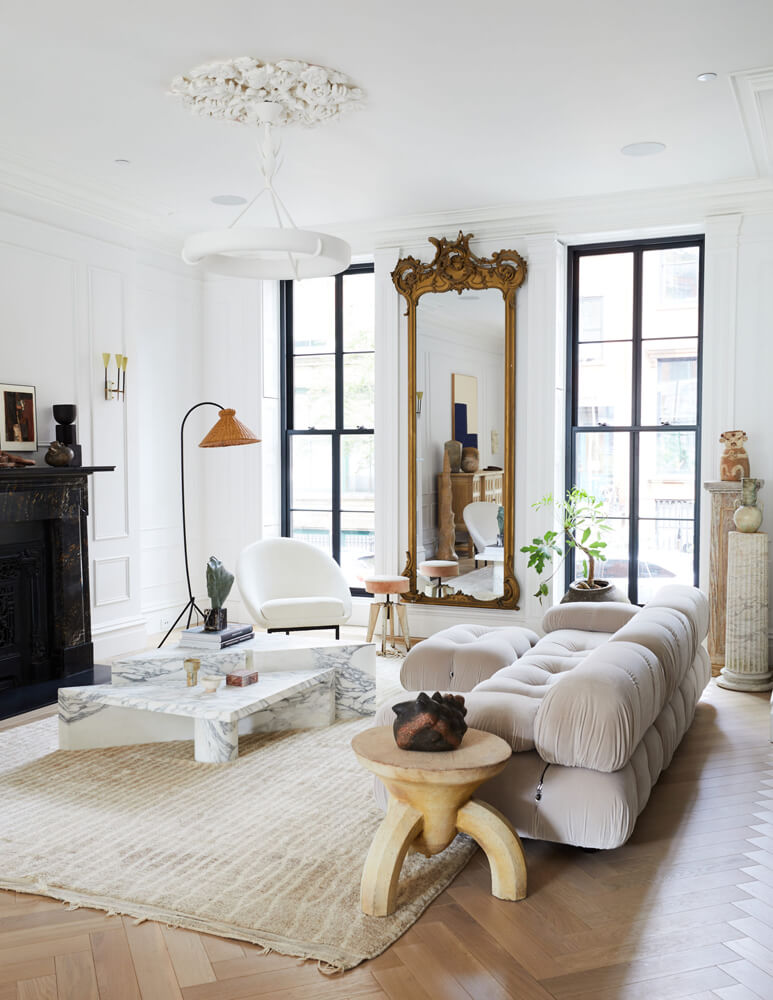 Contemporary Living room with gold accents and large windows