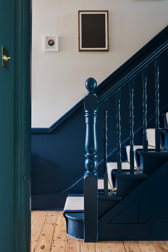 Hallway and staircase painted in Lick Blue 07 in the home of Jim Chapman