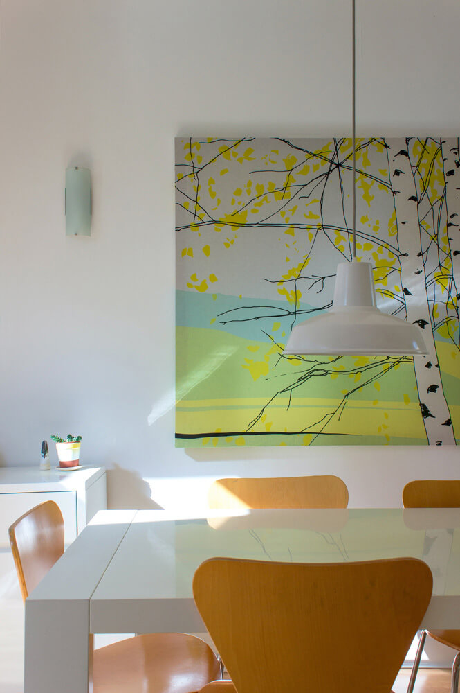 Miami art deco style dining room with a painting of trees
